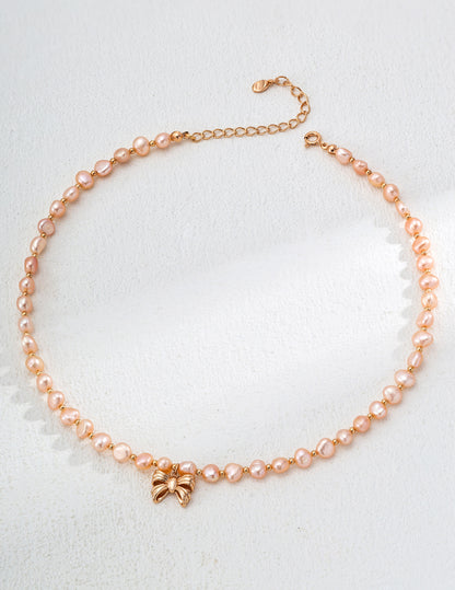 Elegant Pink Pearl Necklace with Gold Butterfly Pendant