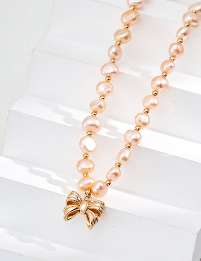 Elegant Pink Pearl Necklace with Gold Butterfly Pendant