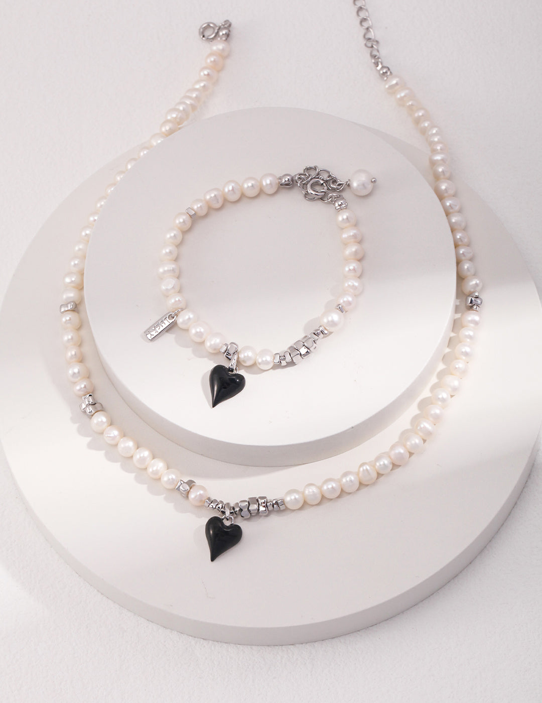 Classic Pearl Bracelet with Black Heart Charm - A Modern Twist