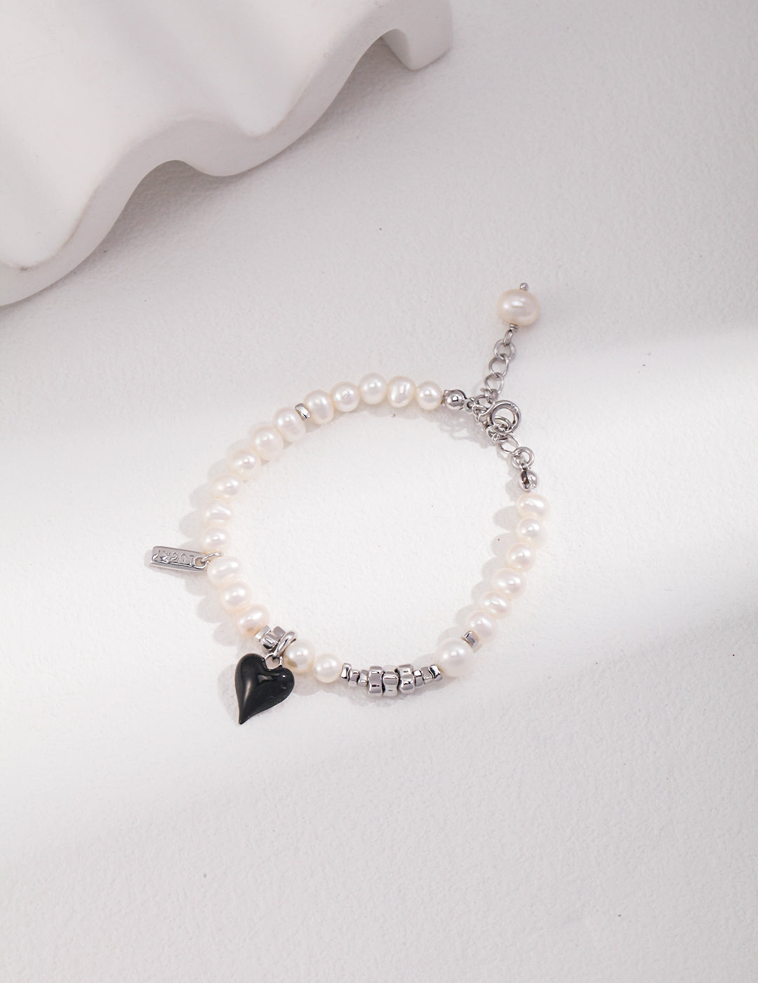 Classic Pearl Bracelet with Black Heart Charm - A Modern Twist