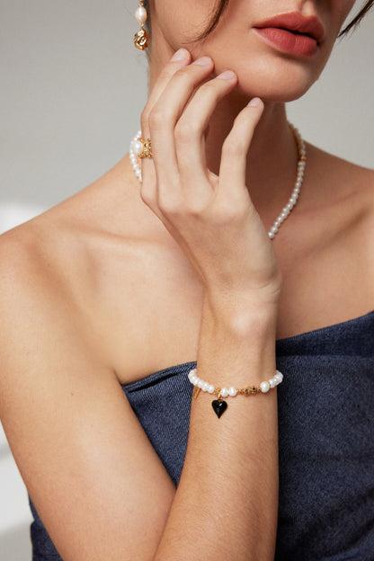 Classic Pearl Bracelet with Black Heart Charm - A Modern Twist