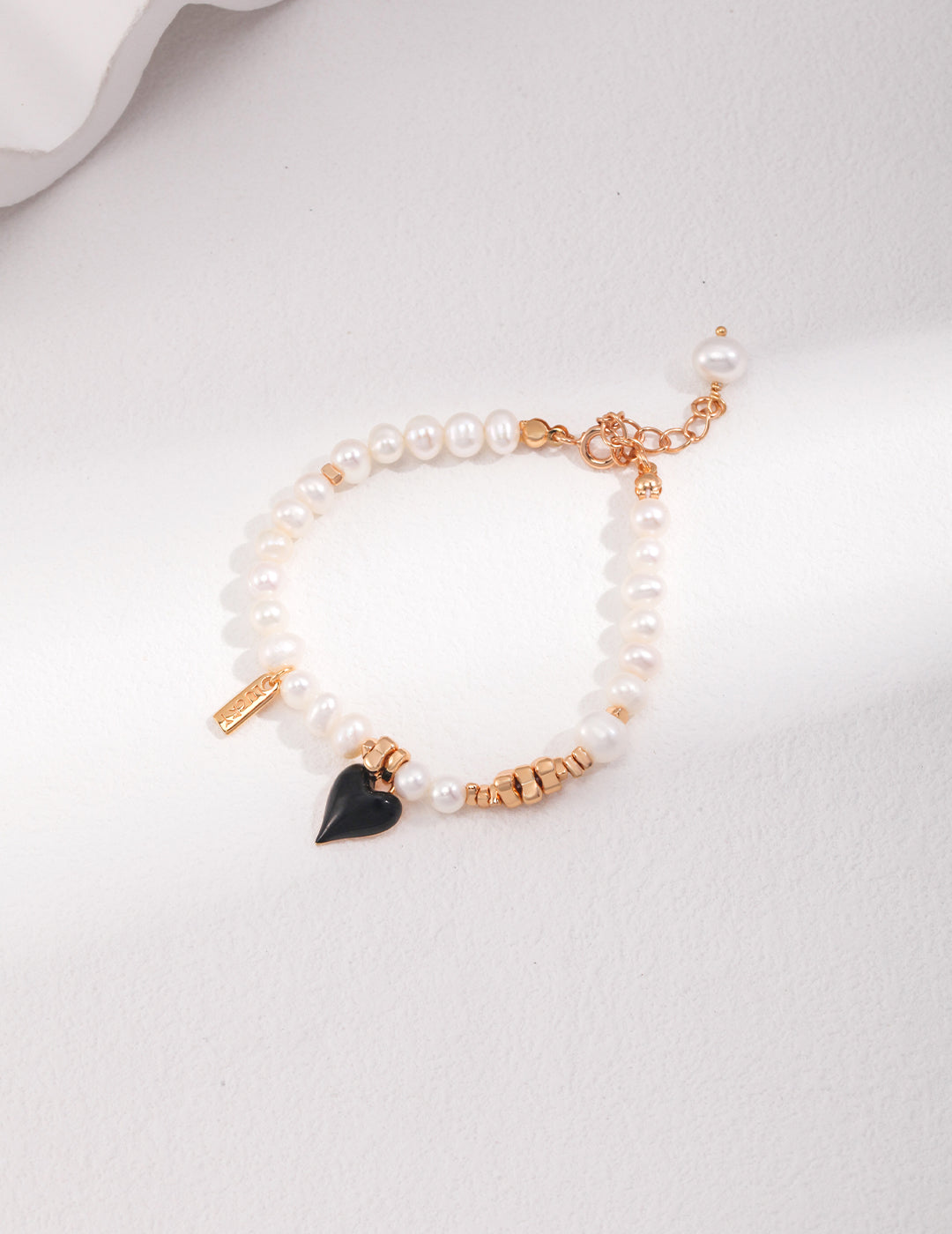 Classic Pearl Bracelet with Black Heart Charm - A Modern Twist