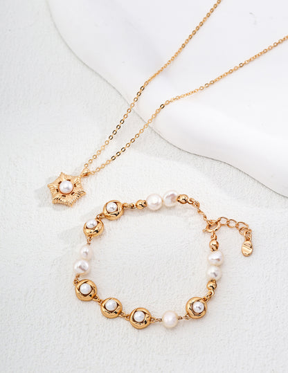 Gold-Plated Pearl Bracelet with Floral Motif and Delicate Chain